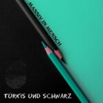 Massiv In Mensch – Türkis und Schwarz